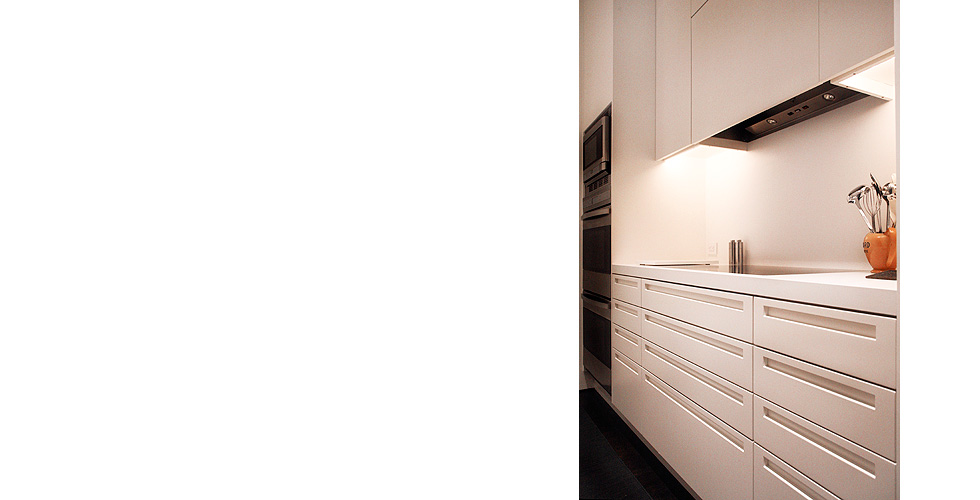 Contemporary cabinetry in the kitchen, bathroom, bedroom and office.