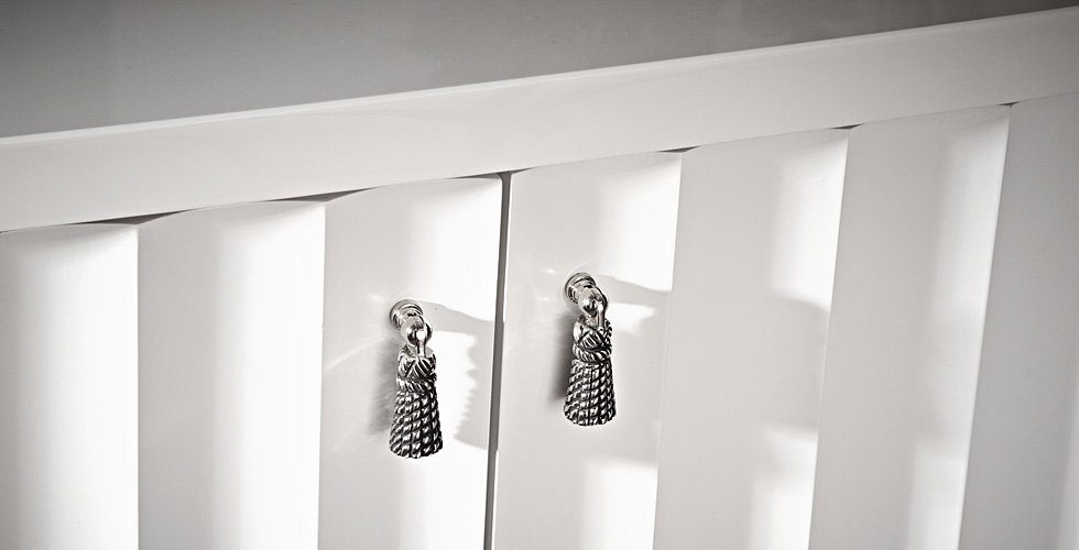 Kitchen with curved and fluted door faces.
