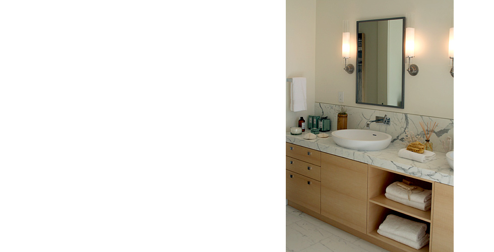 Custom English sycamore veneer bathroom cabinetry.