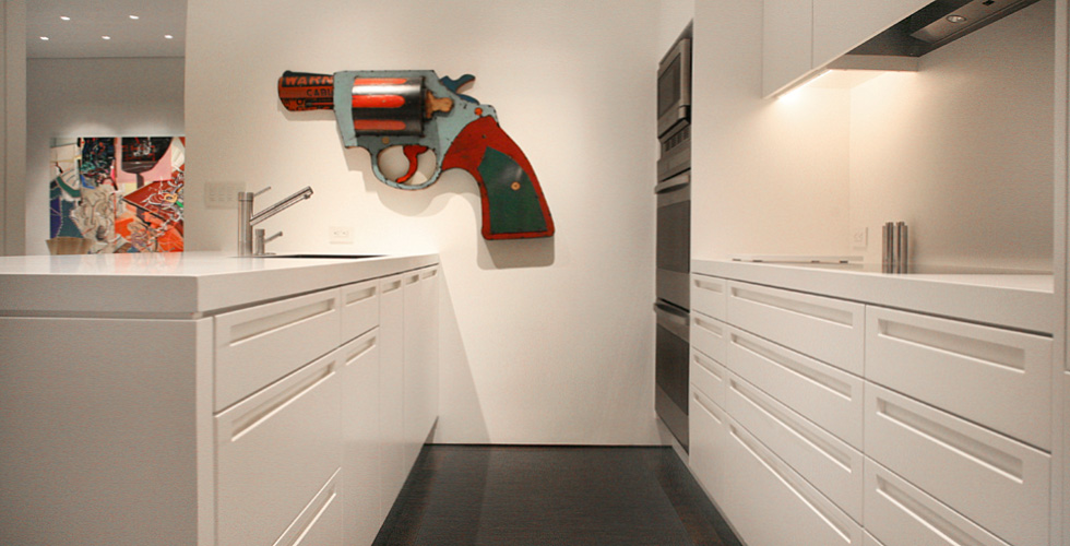 Contemporary cabinetry in the kitchen, bathroom, bedroom and office.