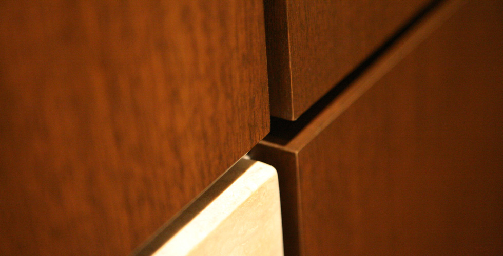Contemporary cabinetry in the kitchen, bathroom, bedroom and office.