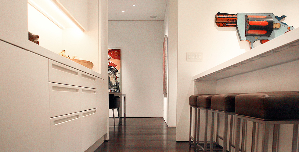 Contemporary cabinetry in the kitchen, bathroom, bedroom and office.