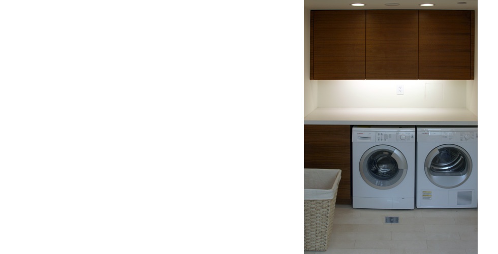 Contemporary laundryroom dark stained cabinets.