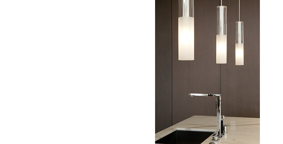 Contemporary kitchen features dark stained cabinets
