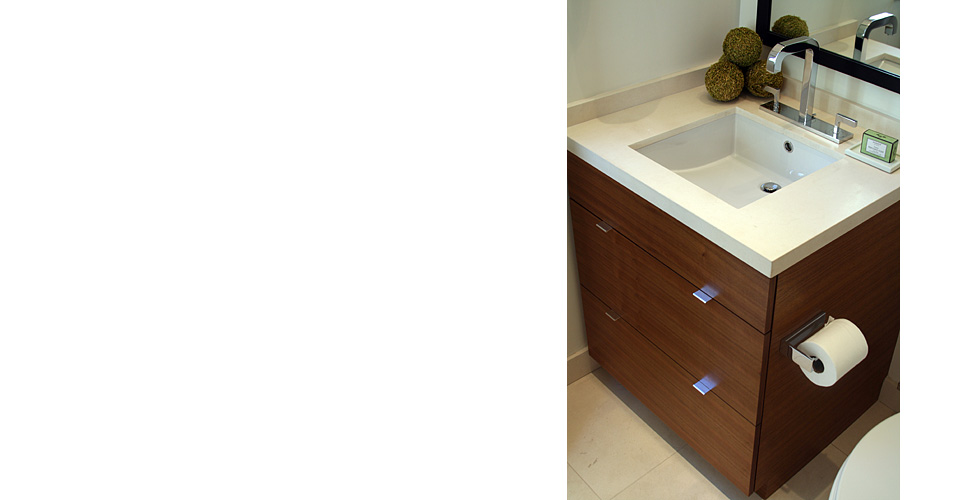 Contemporary bathroom features dark stained cabinets