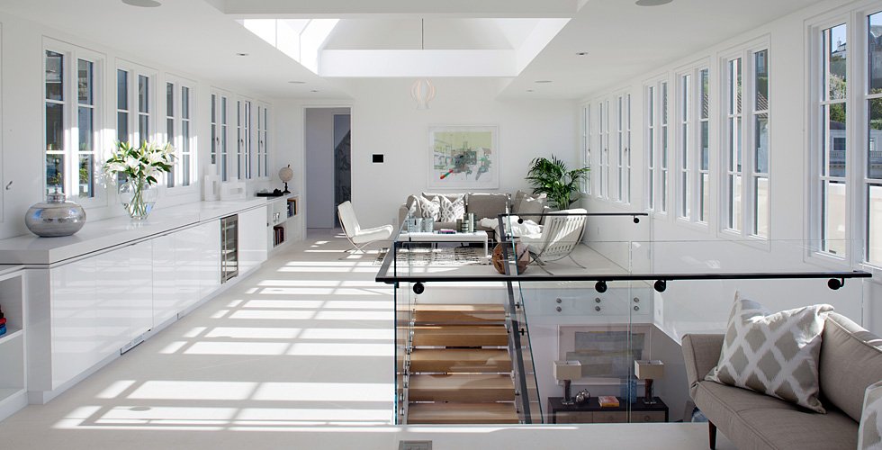 Contemporary living room with white high gloss cabinetry
