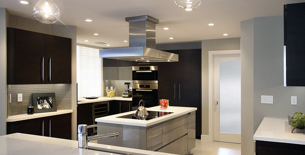 Kitchen island with a seamless channel for opening the doors and drawers